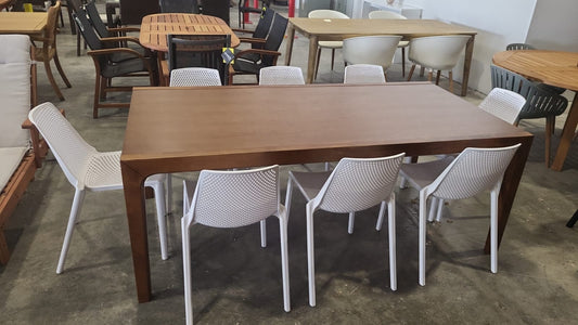 WAS $799 NOW $399 BRAND NEW ORIGINAL PACKAGING INDOOR TABLE 79" X 40" SOLID WOOD TABLE WITH 8 RECYCLED RESIN WHITE STACKABLE CHAIRS